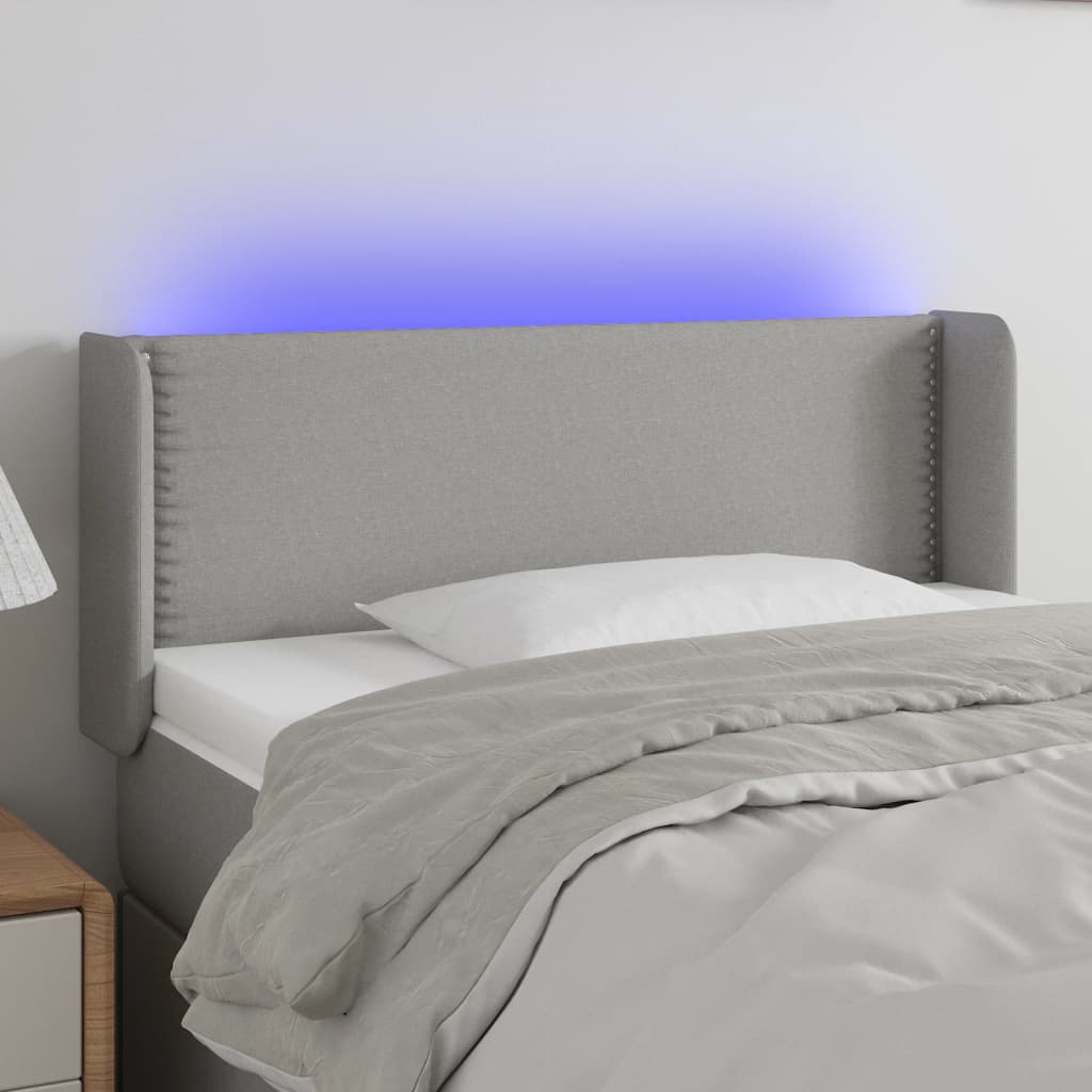 vidaXL Zagłówek do łóżka z LED, jasnoszary, 83x16x78/88 cm, tkanina